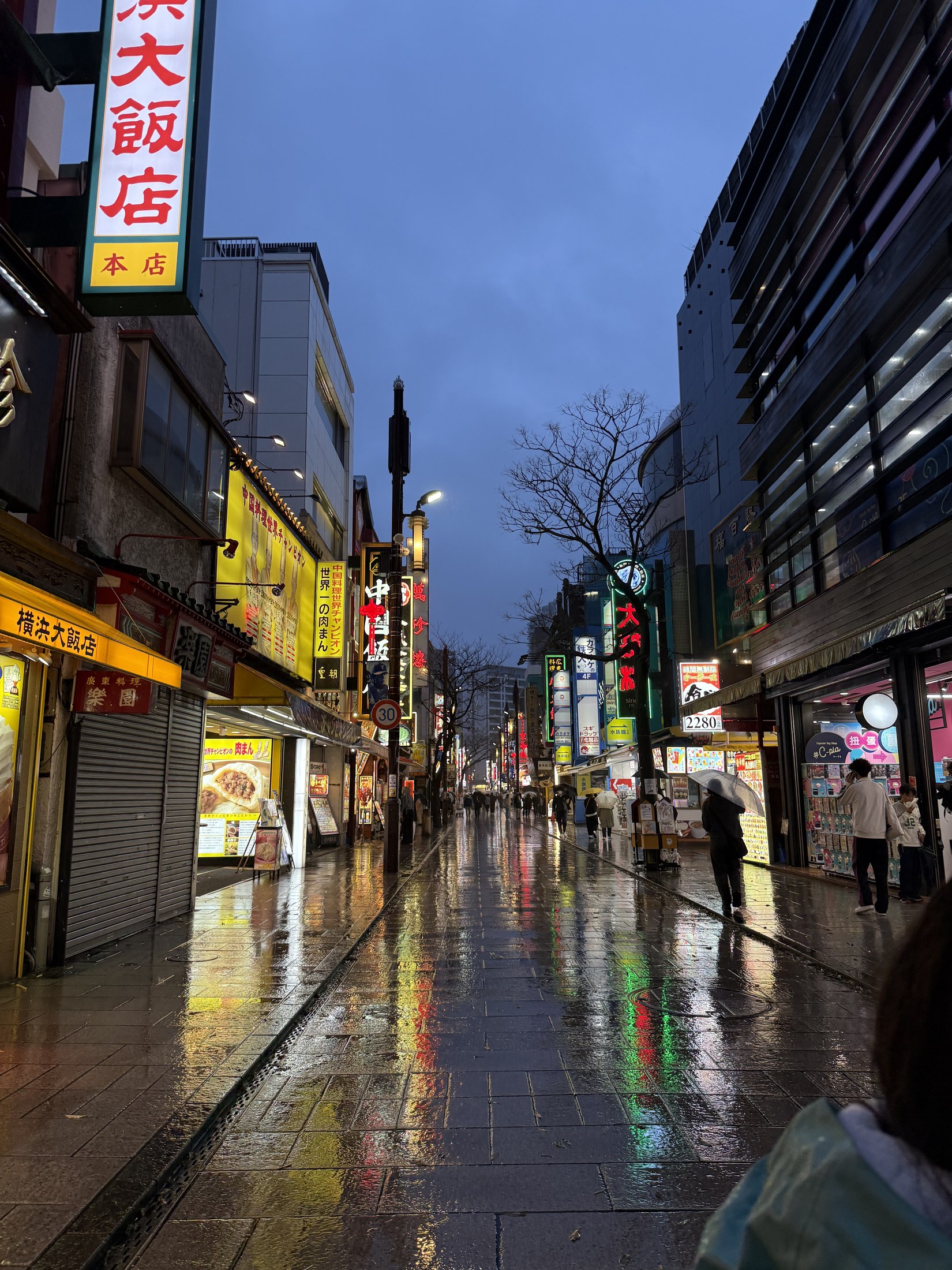 A lantern-lit street in Yokohama at dusk